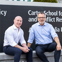 Dean Ozerdem with Joe Schniebs outside of Mason Square campus