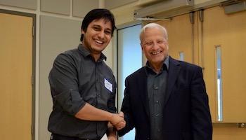 Photo of conflict and peace studies student receiving scholarship award from the dean