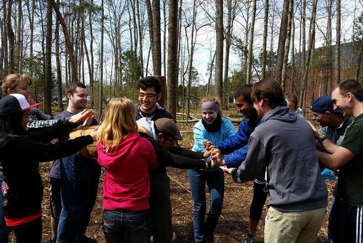 students are outdoors gaining experience in team building