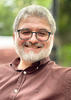 Malkhaz Saldadze smiling and wearing glasses outside