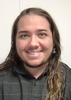 Headshot photo of Liam Lassiter smiling